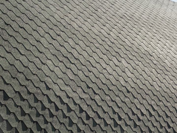 After: an even grey asphalt shingle roof